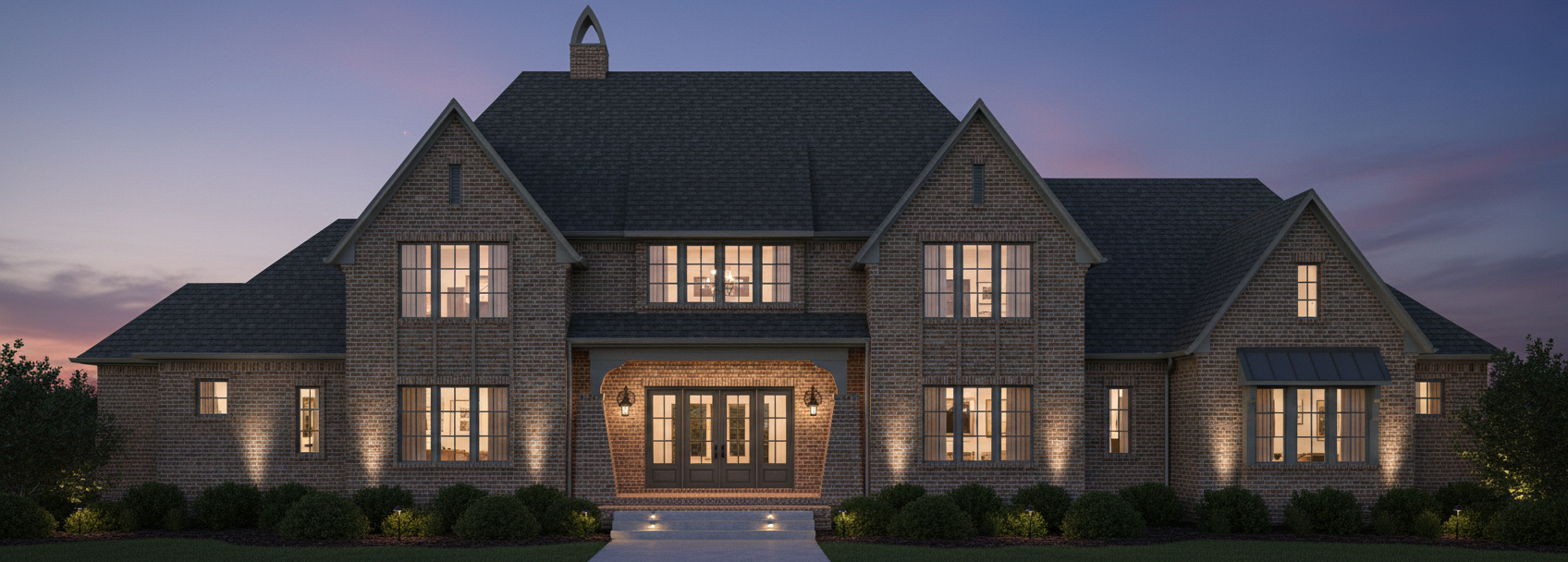 Front elevation of the second residence at dusk.